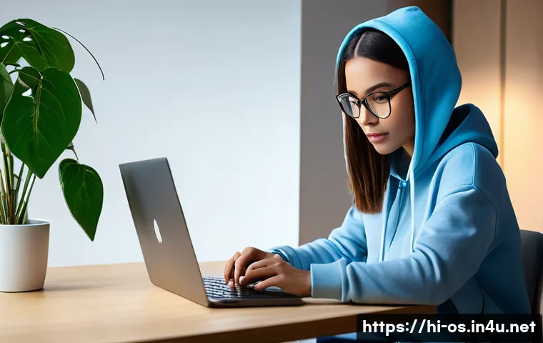 macOS의 보안 및 개인정보 보호 설정 - A focused young adult, gender-neutral, wearing a stylish but modest hoodie and jeans, is seated comf...